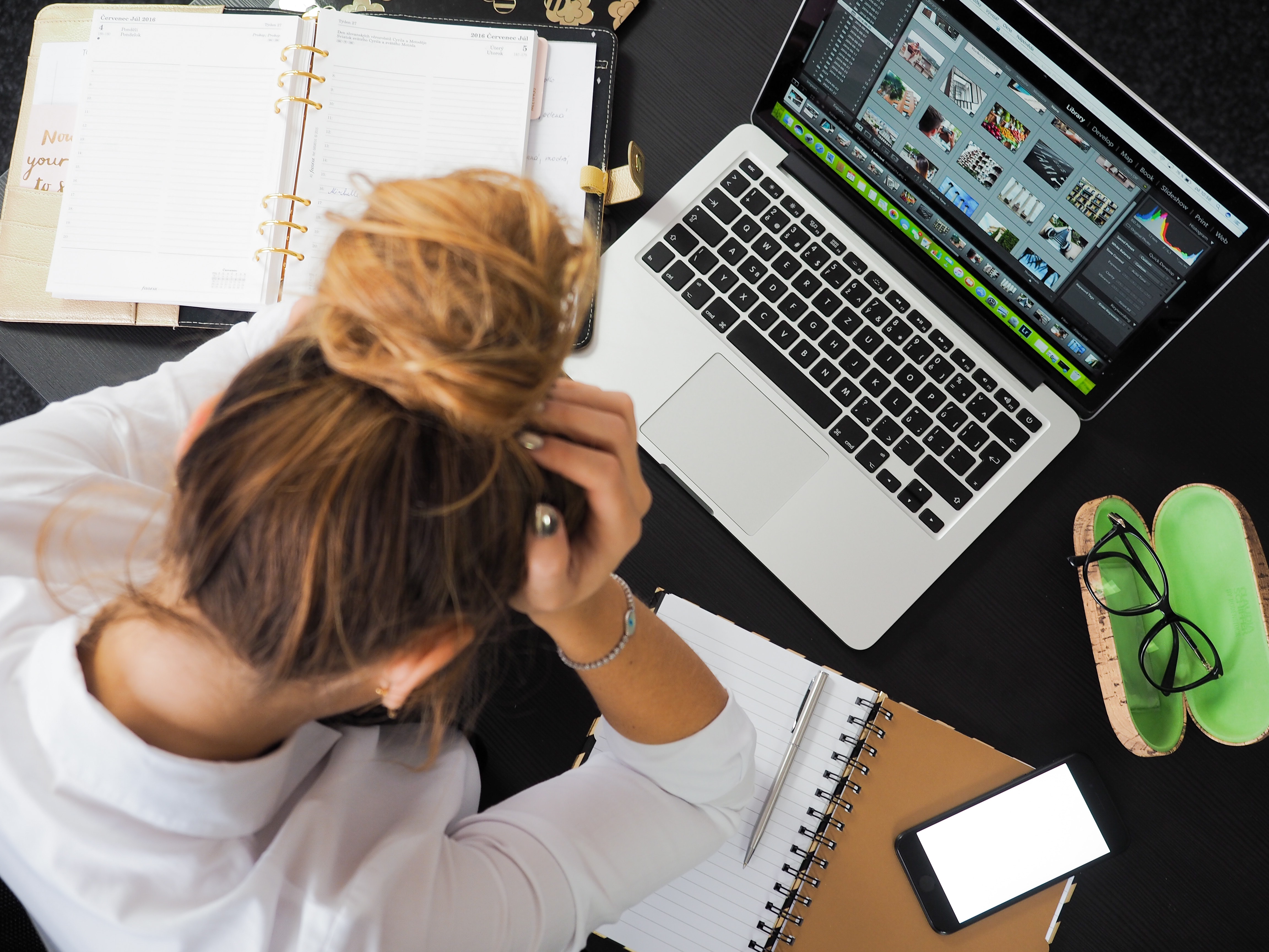 woman sitting in fromt of macbook